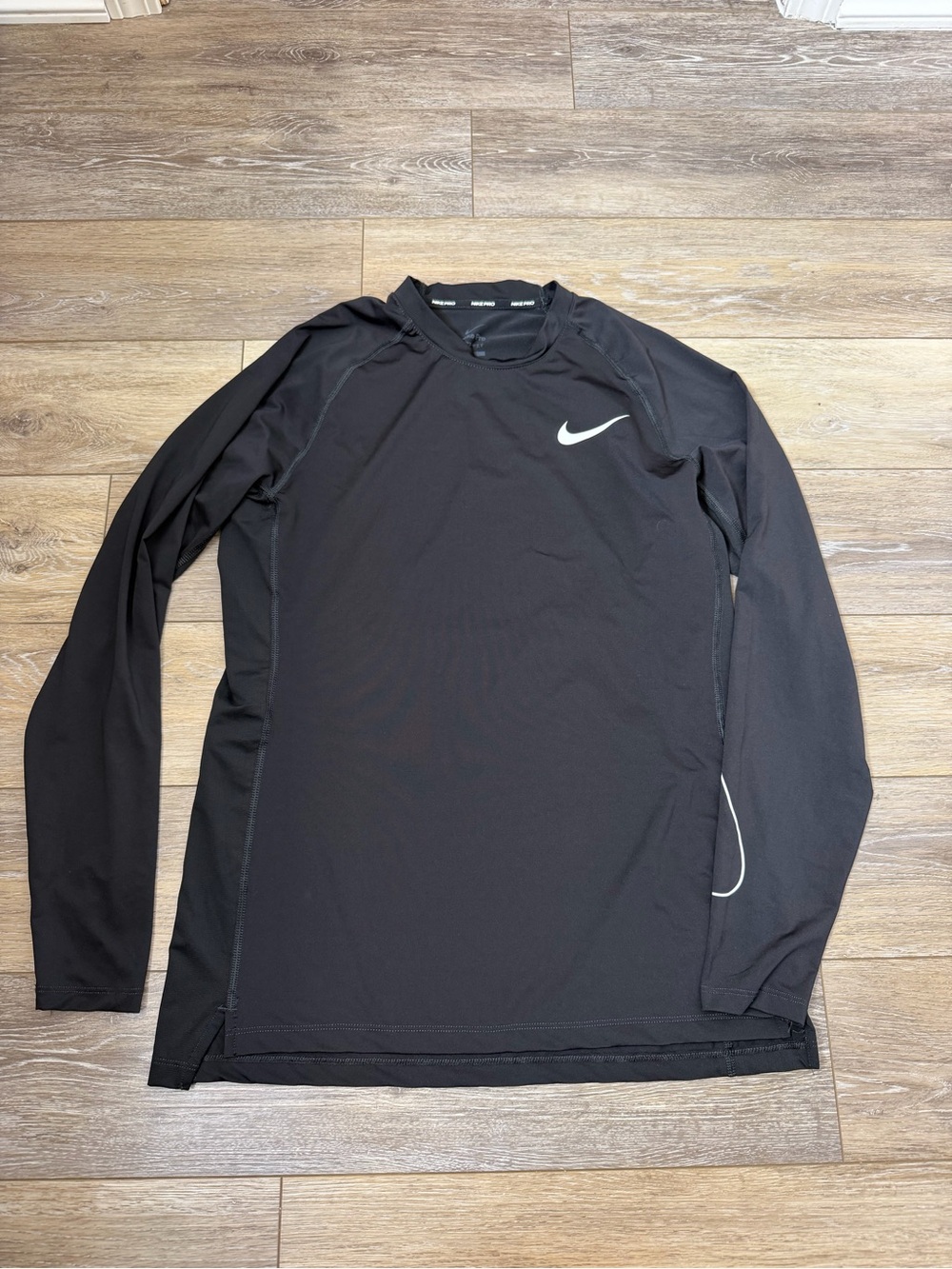 Nike Black Long Sleeve Athletic Top with White Swoosh